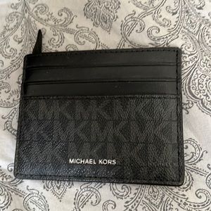This is a micheal kors wallet, anyone can use it also, it’s brand new never used